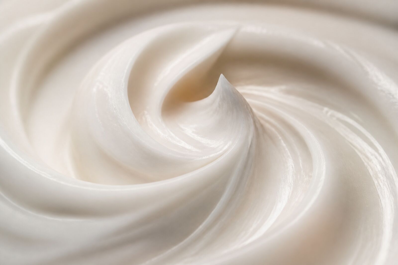 A swirl of white lotion texture, macro shot