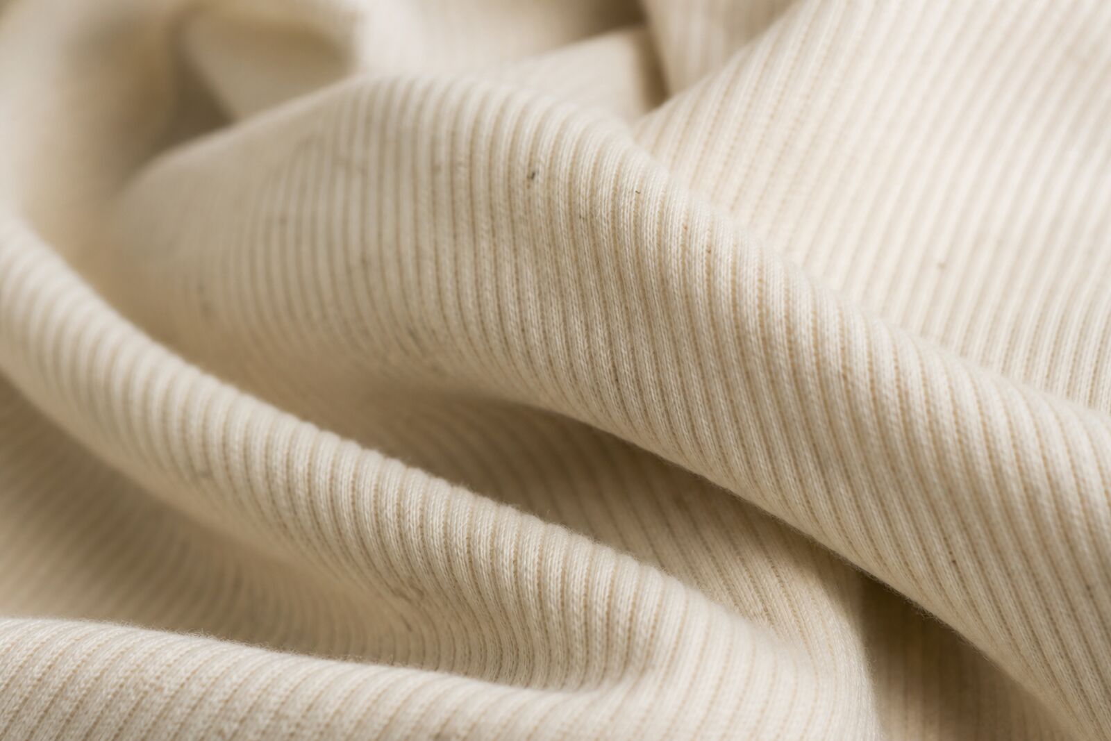 Macro shot of soft ribbed organic cotton fabric texture